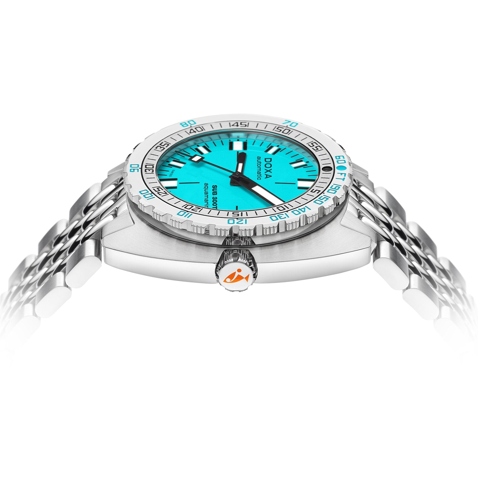 The DOXA Sub 300T Aquamarine is a silver divers watch featuring a vibrant aquamarine dial, black hour markers, and a stainless steel bracelet, highlighted from a low angle with its crown, case side, and helium release valve.