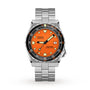The DOXA Sub 600T Professional dive watch features a stainless steel case, orange dial, black bezel, and date display at 3 o’clock.