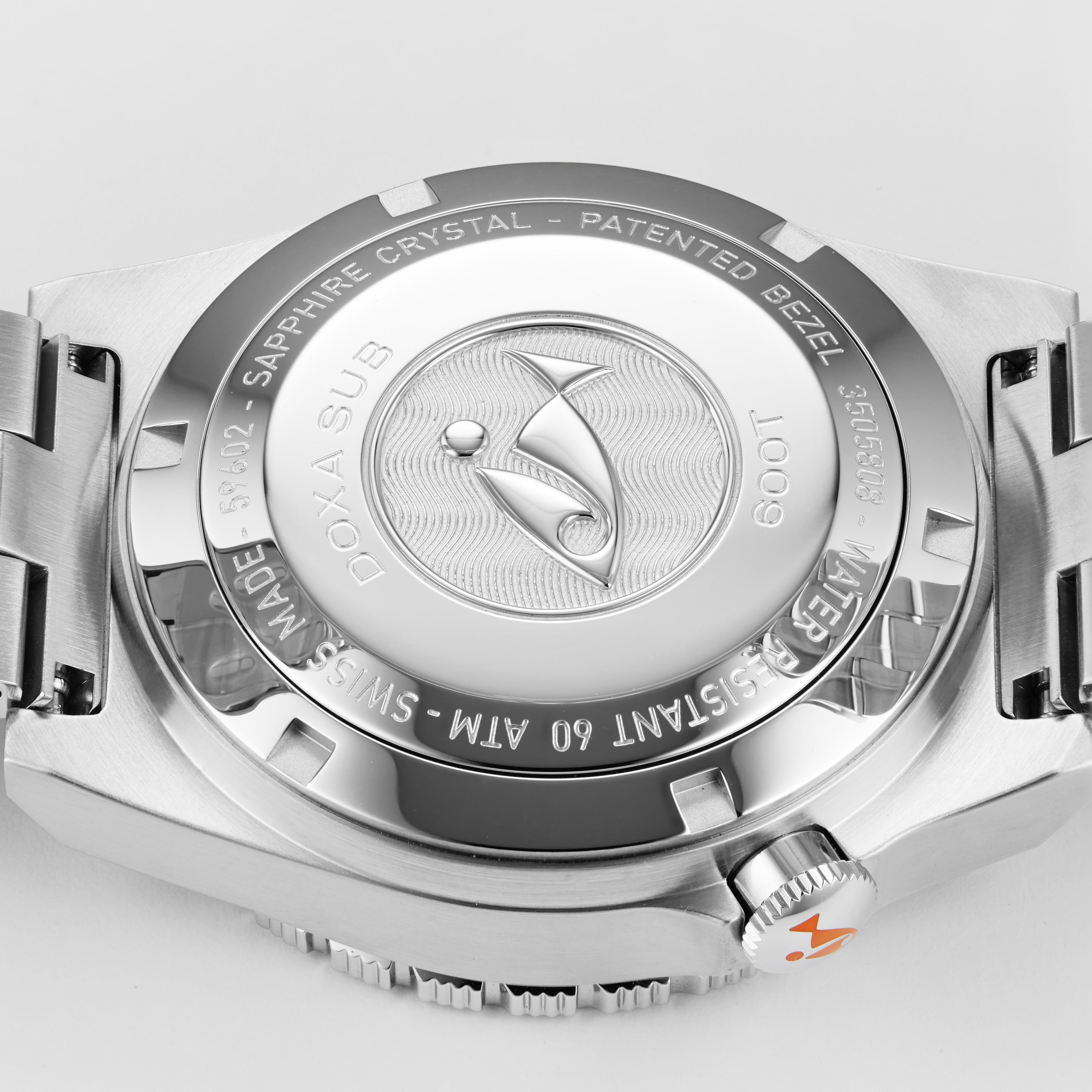 Close-up of the back of the DOXA Sub 600T Professional dive watch, showcasing engraved text, logo, and a stainless steel bracelet.