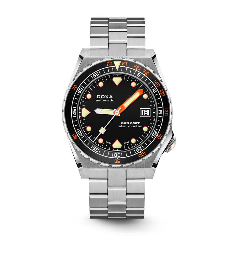 The DOXA Sub 600T Sharkhunter is a stainless steel automatic dive watch featuring a black dial, orange and white markers, date window at 3 oclock, and a metal link bracelet.