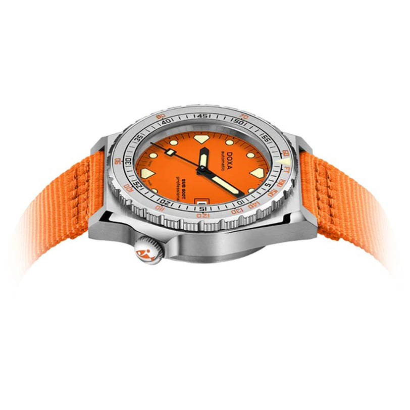The DOXA Sub 600T Professional is a stainless steel diver’s watch with an orange dial, matching orange fabric strap, rotating bezel, and bold hour markers.