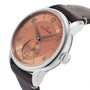 The Louis Erard Petite Seconde Terracotta 42 features a copper dial, brown leather strap, and silver case, displayed angled to the left.