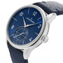 The Louis Erard Petite Seconde Bleu Nuit wristwatch features a blue dial, silver case, and blue leather strap, displaying the time 10:09.
