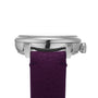 Side view of the Louis Erard Petite Seconde Violette, featuring a silver case and textured purple leather strap, displayed against a white background.