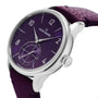 The Louis Erard Petite Seconde Violette wristwatch features a silver case, a purple dial, and a matching purple leather strap, displayed at an angle.