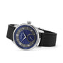 The Louis Erard Petite Seconde Guilloché Anthracite Blue is a luxury wristwatch featuring a blue patterned dial, silver case, and black leather strap, displayed at an angle.
