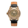 The William Wood Chivalrous Collection - Chocolate features a gold case back engraved with WILLIAM WOOD WATCH CO and a helmet, paired with a black and tan leather strap.