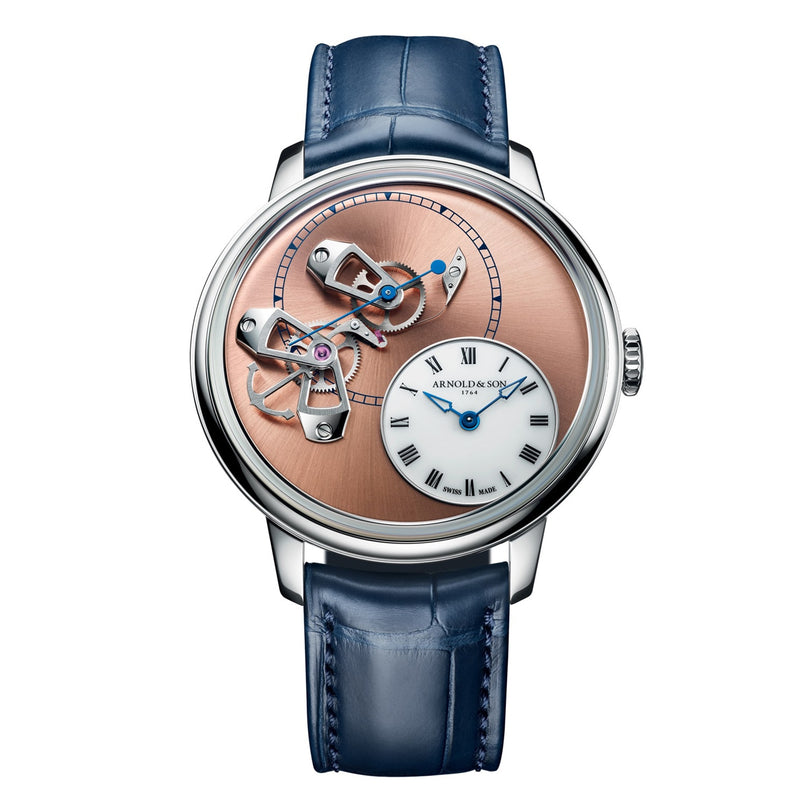 The Arnold & Son DSTB 42 Platinum is a luxury watch featuring an open mechanism dial in rose gold and silver, a blue leather strap, and a Roman numeral subdial.