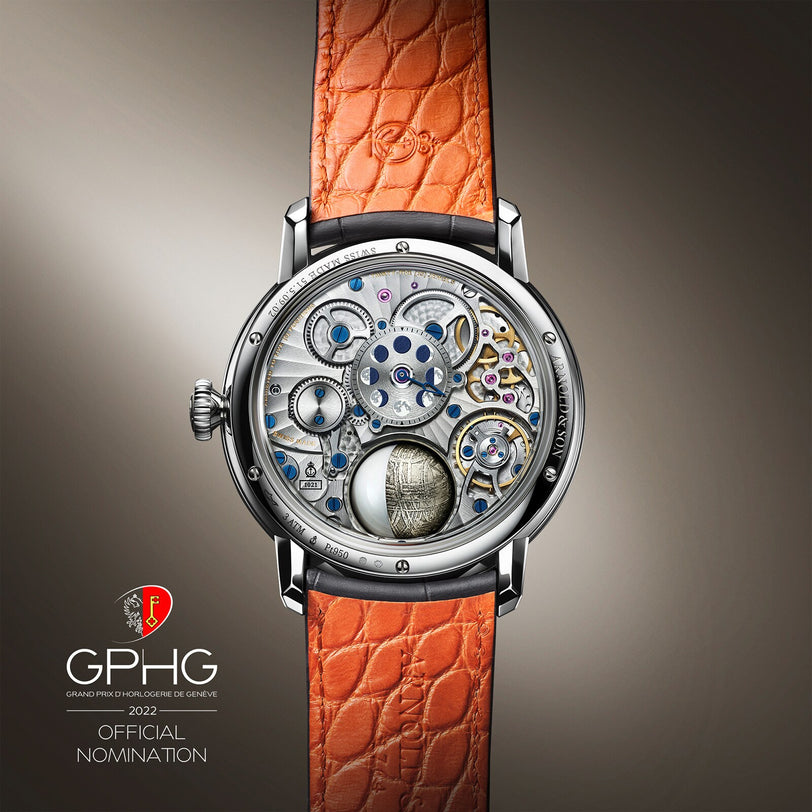 The Luna Magna Platinum by Arnold & Son features an exposed intricate mechanical back, an orange textured leather strap, and was nominated for the GPHG 2022.