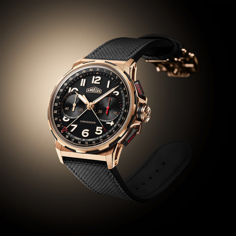 The Angelus Chronodate Gold Black wristwatch features a black strap, gold case, and black dial with white numerals and red accents.