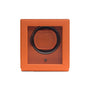The WOLF Cub Single Watch Winder with Cover features an orange square design and a transparent front panel that displays the watch holder inside.
