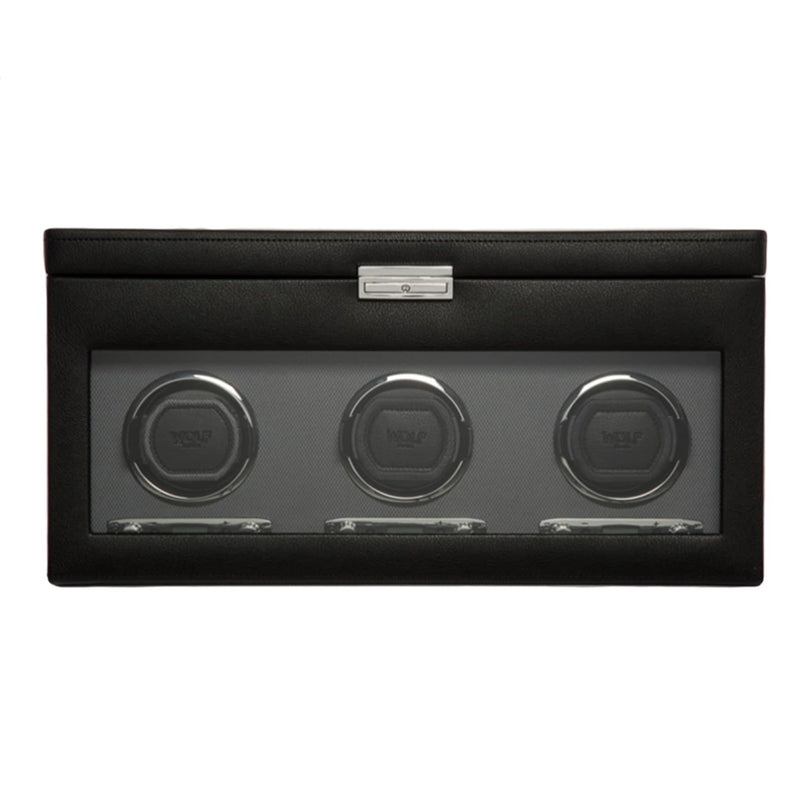 The WOLF Classic Triple Watch Winder with Storage features a glass front displaying three winding slots for watches.