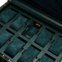 The WOLF British Racing 10 Piece Watch Box features an open green leather design with multiple velvet-lined compartments and cushioned slots.