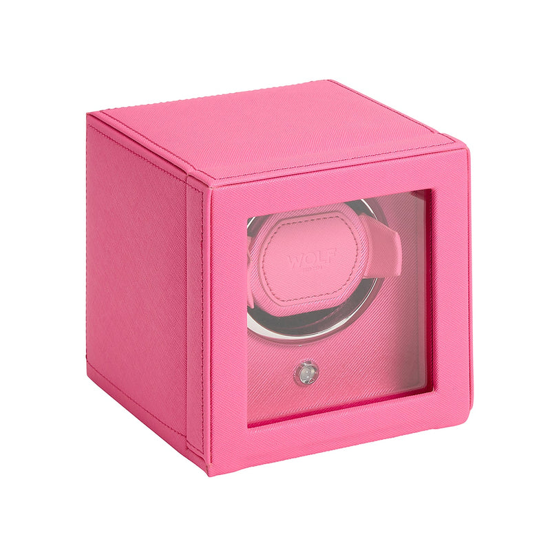The WOLF Cub Single Watch Winder with Cover is a pink box featuring a transparent front that displays the watch holder inside.