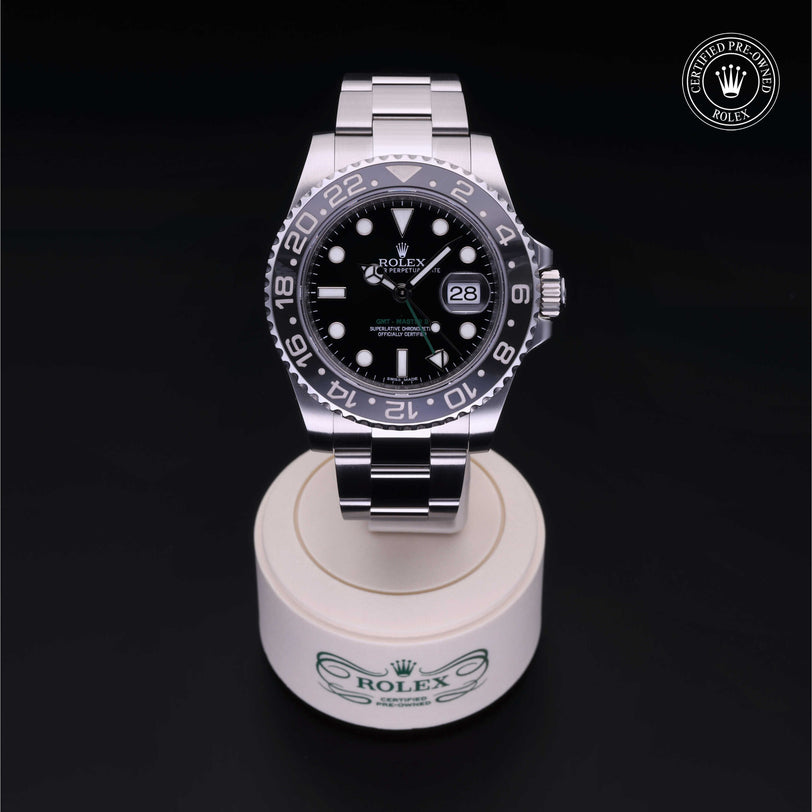 Rolex Certified Pre-owned GMT M116710LN-0001 front on black background