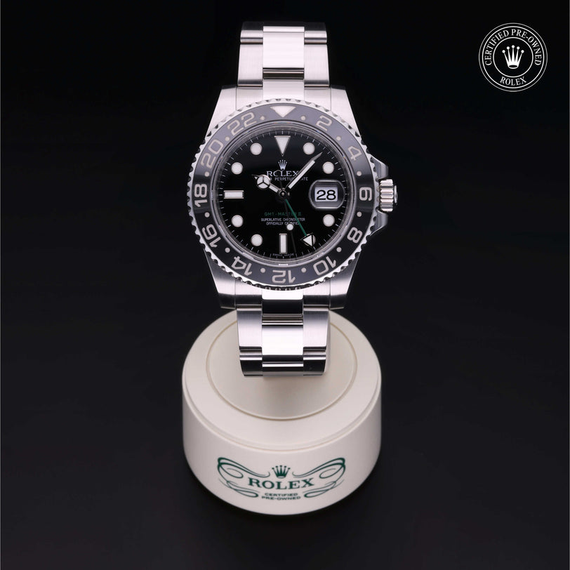 Rolex Certified Pre-owned GMT II M116710LN-0001 front on black background