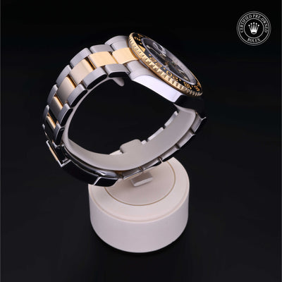 Rolex Certified Pre-owned GMT M116713LN-0001 front on black background