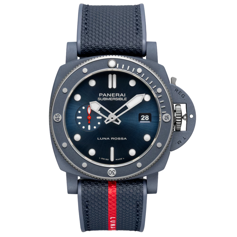 The Panerai Submersible QuarantaQuattro Luna Rossa Ti-Ceramitech™ features a navy blue dial, textured strap with red stripe, luminescent markers, date display, and a robust diver’s casing.