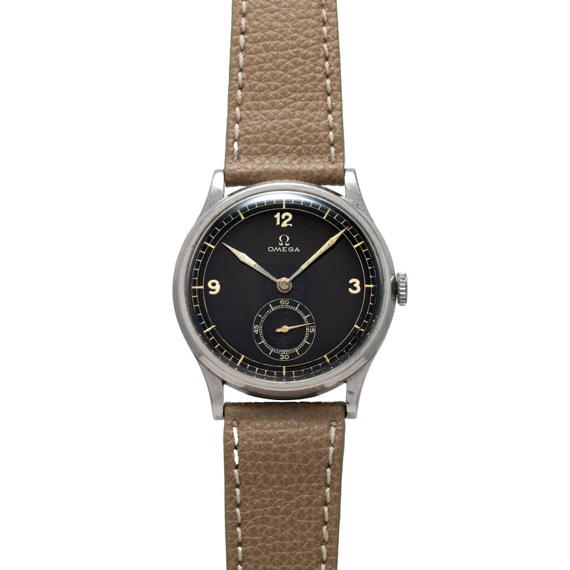 The OMEGA Jumbo Calatrava features a black dial and tan leather strap, displaying the time at 11:50.