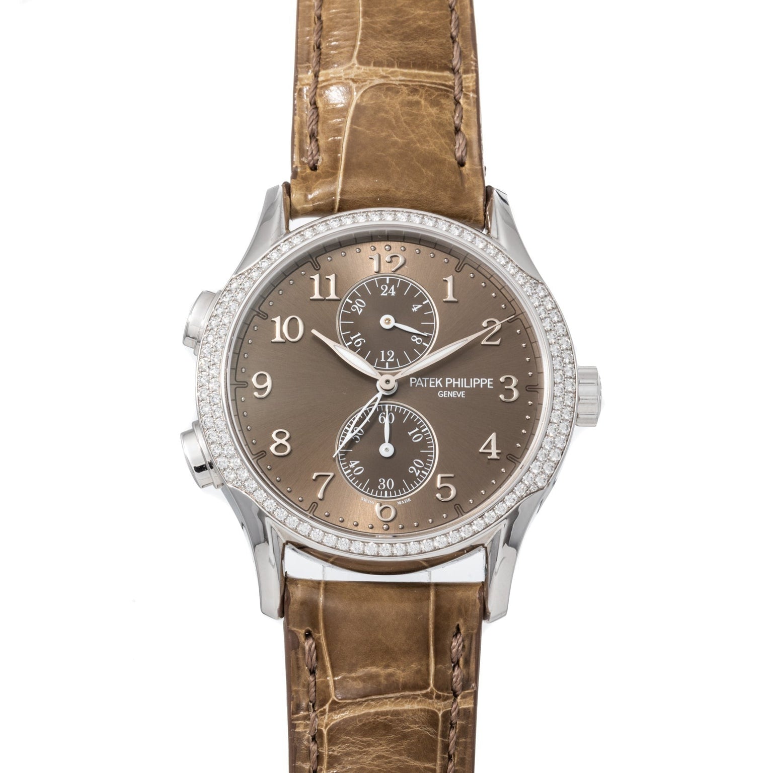Patek Philippe Calatrava Travel Time Ladies watch featuring a brown dial, diamond bezel, and brown leather strap displayed on a white background.