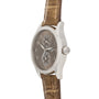 The Patek Philippe Calatrava Travel Time Ladies watch features a brown leather strap, silver case, and two subdials on a dark dial for a luxurious look.