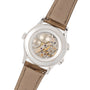 The Patek Philippe Calatrava Travel Time Ladies features a visible mechanical movement, brown leather strap, and stainless steel case back for a luxurious touch.