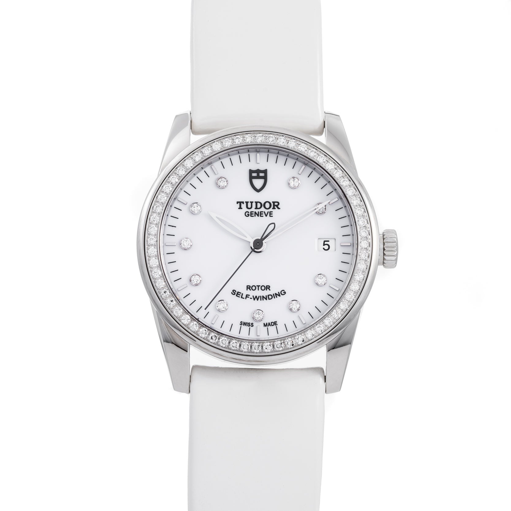 The TUDOR Glamour Date women’s watch features a white strap, diamond hour markers, and a date display at 3 o’clock.