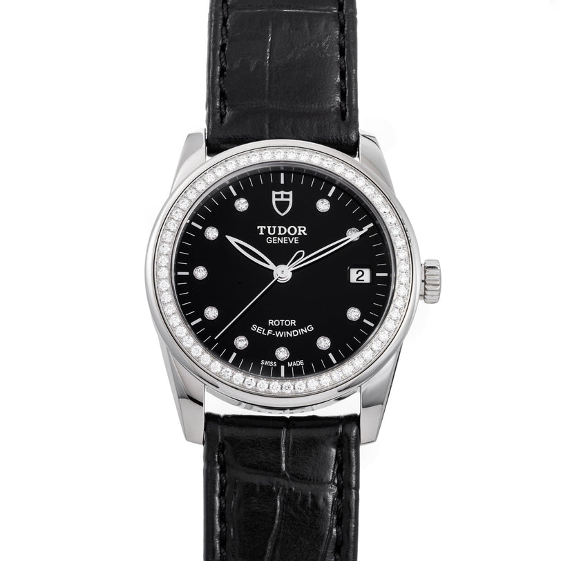 TUDOR Glamour Date wristwatch featuring a black dial, diamond hour markers, date display, and black leather strap.