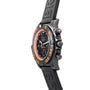 Side view of the Breitling Chronomat Raven wristwatch featuring orange accents and a black rubber strap.