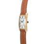 Cartier Tank Cintrée Ladies gold rectangular wristwatch with brown leather strap and Roman numeral dial, shown from the side.