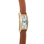 Cartier Tank Cintrée Ladies watch featuring a gold rectangular case, white dial with Roman numerals, and a brown leather strap.