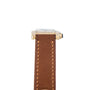 Side view of the Cartier Tank Cintrée Ladies featuring a gold case and brown leather strap with visible stitching.
