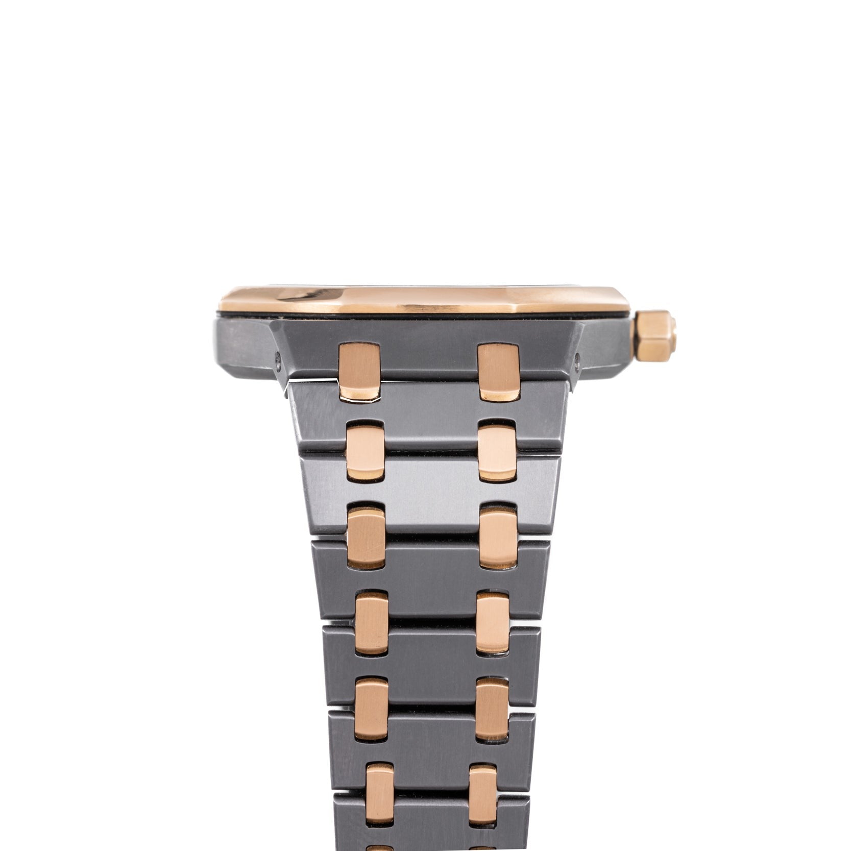 Close-up of the Audemars Piguet Royal Oak Tantalum watch, highlighting its metal band with gold accents and the side profile of the case.