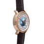 The Vacheron Constantin Traditionnelle World Time is a luxury wristwatch featuring a brown leather strap, rose gold case, and displays multiple world time zones.