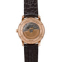 Back view of the Vacheron Constantin Traditionnelle World Time showing its mechanical movement and brown leather strap.