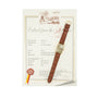 A Patek Philippe Birks Rectangular Dress Watch with a brown leather strap is placed on an official certificate document.