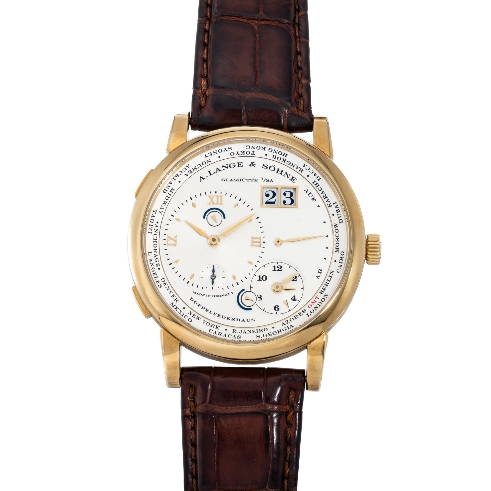 The Lange & Sohne Lange 1 Timezone features a gold case, brown leather strap, white dial with multiple subdials, and city names around the face.