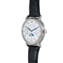 The Lange & Sohne Lange 1815 Annual Calendar features a moonphase dial, blue accents on a white face, and a black leather strap.