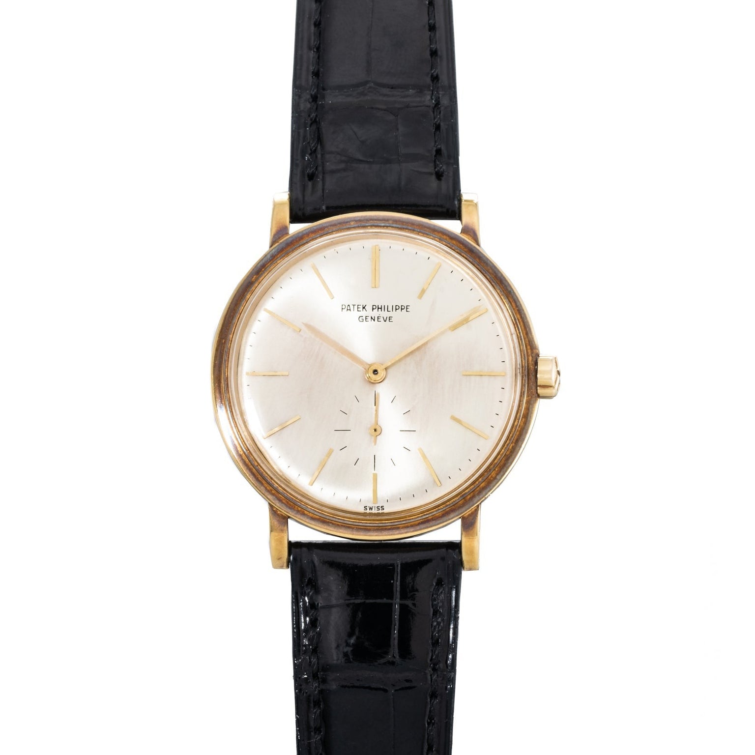 Patek Philippe Calatrava Waterproof gold wristwatch with a white dial and black leather strap, displaying 5:00.