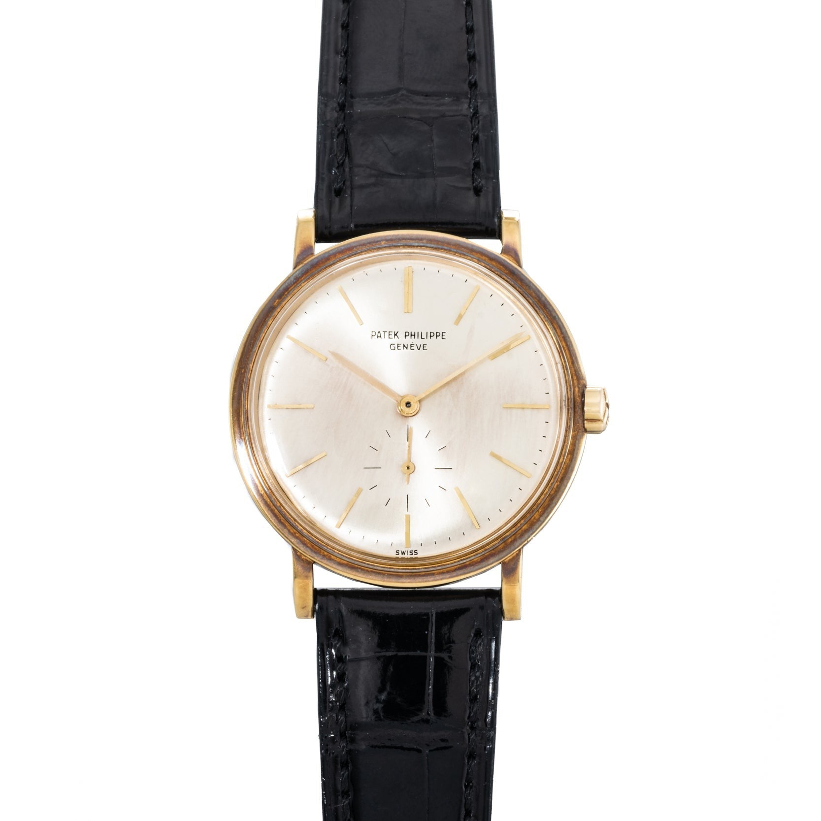 Patek Philippe Calatrava Waterproof gold wristwatch with a white dial and black leather strap, displaying 5:00.