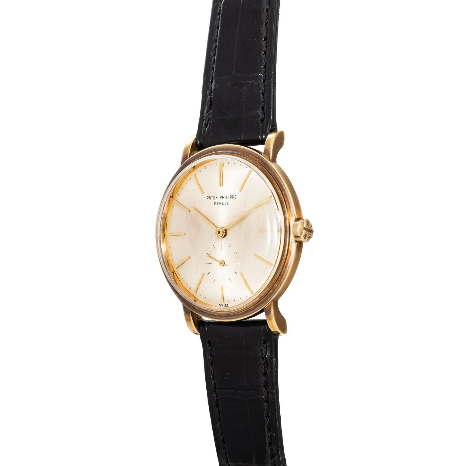 Patek Philippe Calatrava Waterproof gold wristwatch with a white dial, black leather strap, and gold hour markers, viewed from an angle.