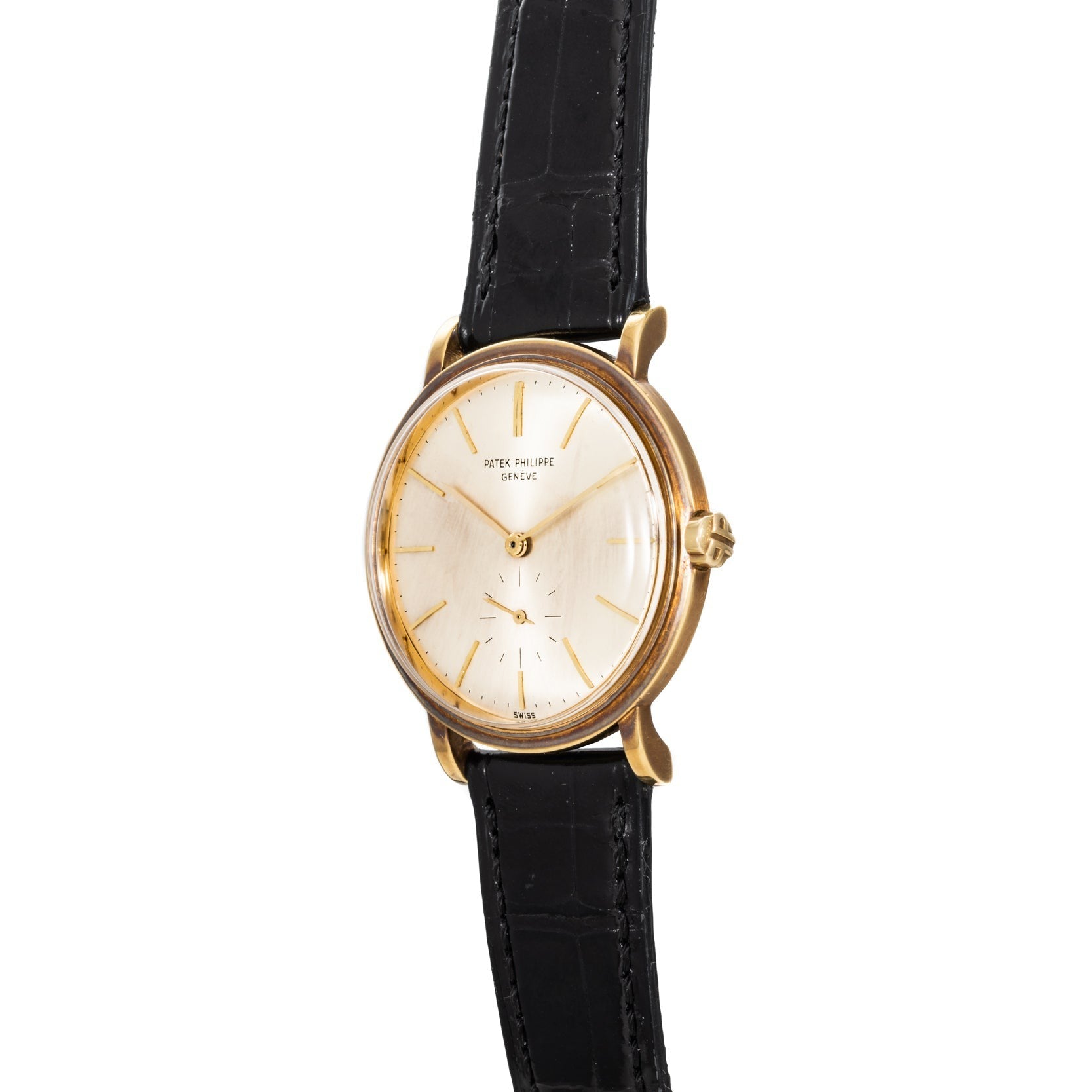 Patek Philippe Calatrava Waterproof gold wristwatch with a white dial, black leather strap, and gold hour markers, viewed from an angle.