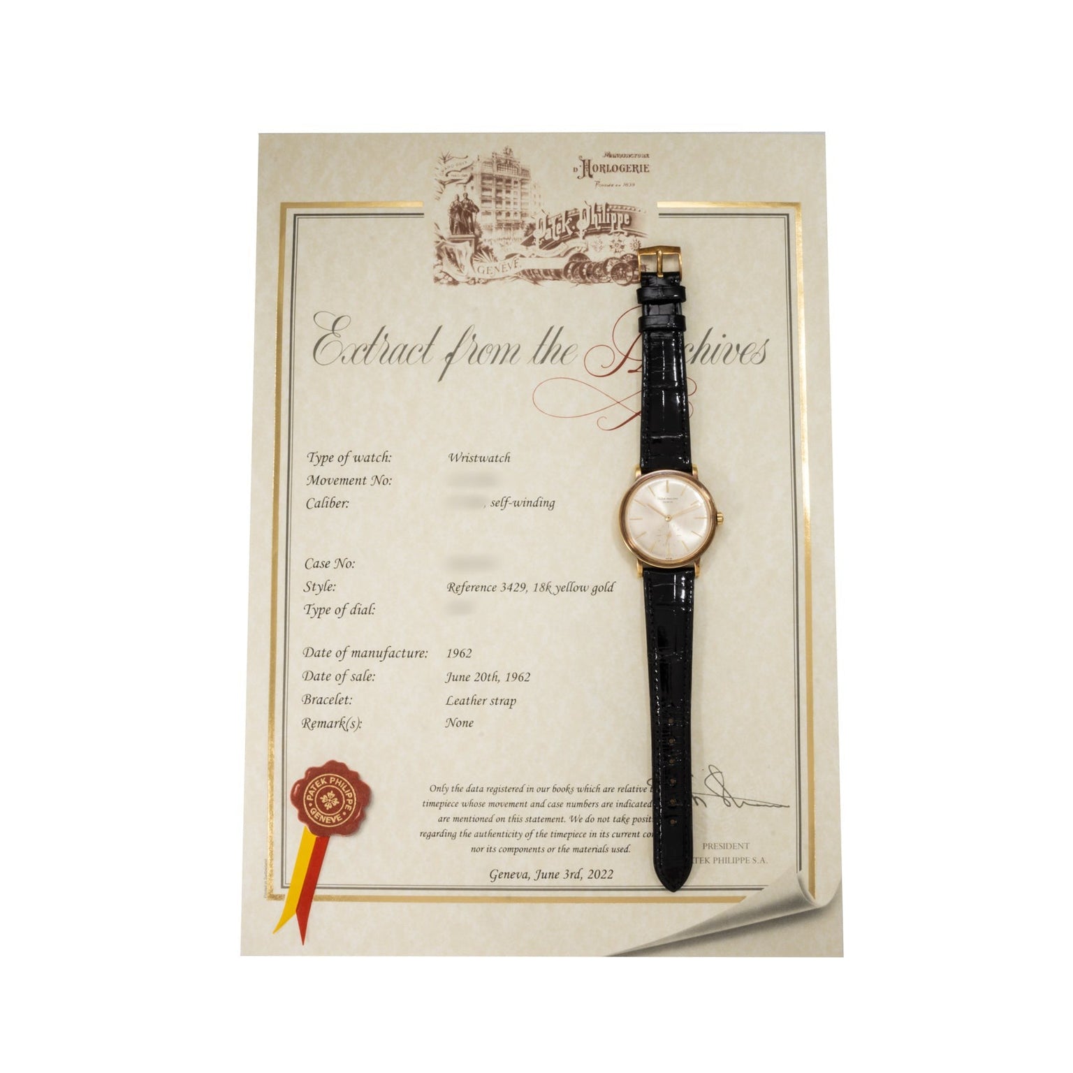 A Patek Philippe Calatrava Waterproof wristwatch with a black leather strap rests on a certificate from the manufacturer’s archives.