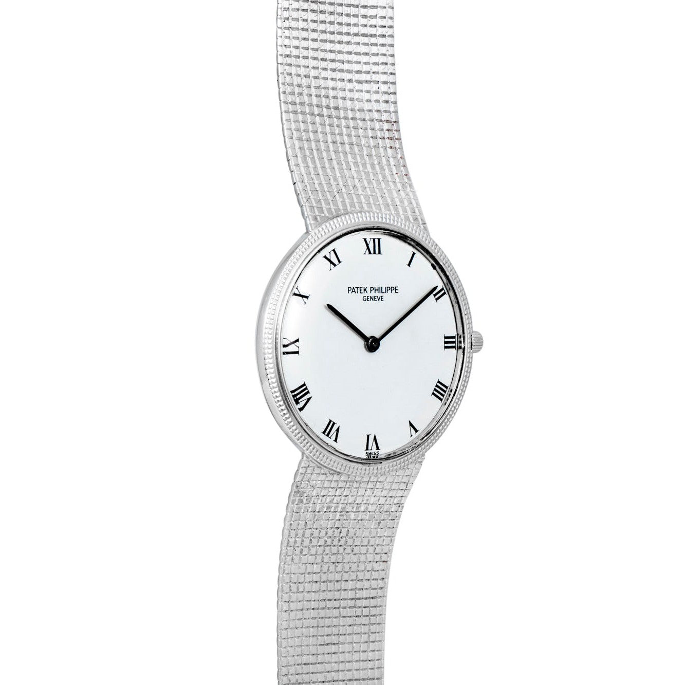 The Patek Philippe Calatrava is a silver watch featuring a white dial with black Roman numerals and a textured metal band.