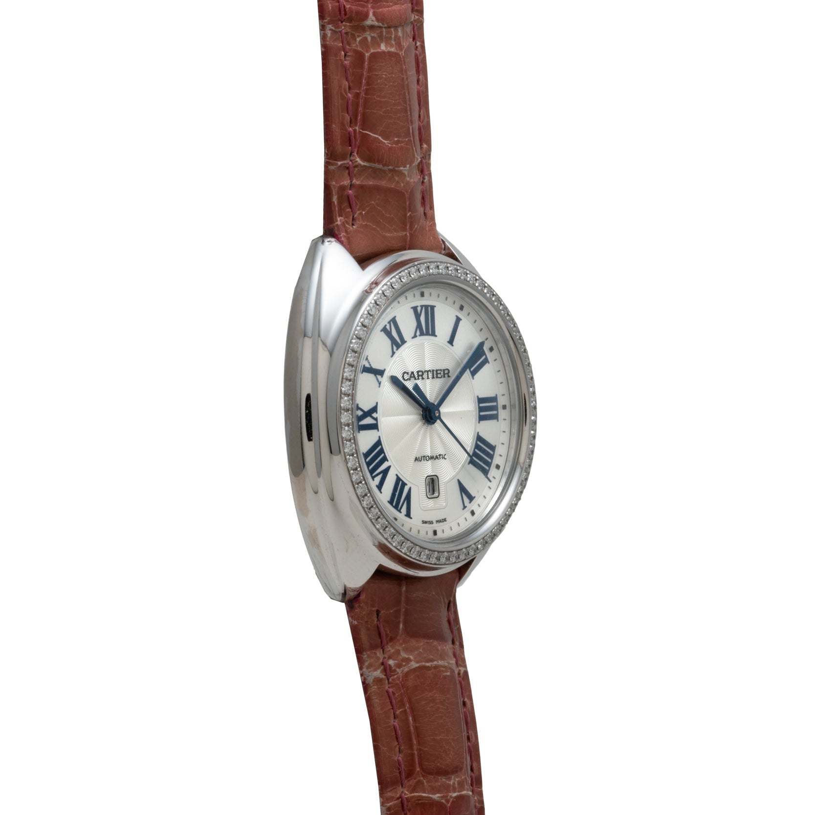 Cartier Cle de Diamond wristwatch with a silver case, brown leather strap, and Roman numerals on the dial, viewed from an angle.