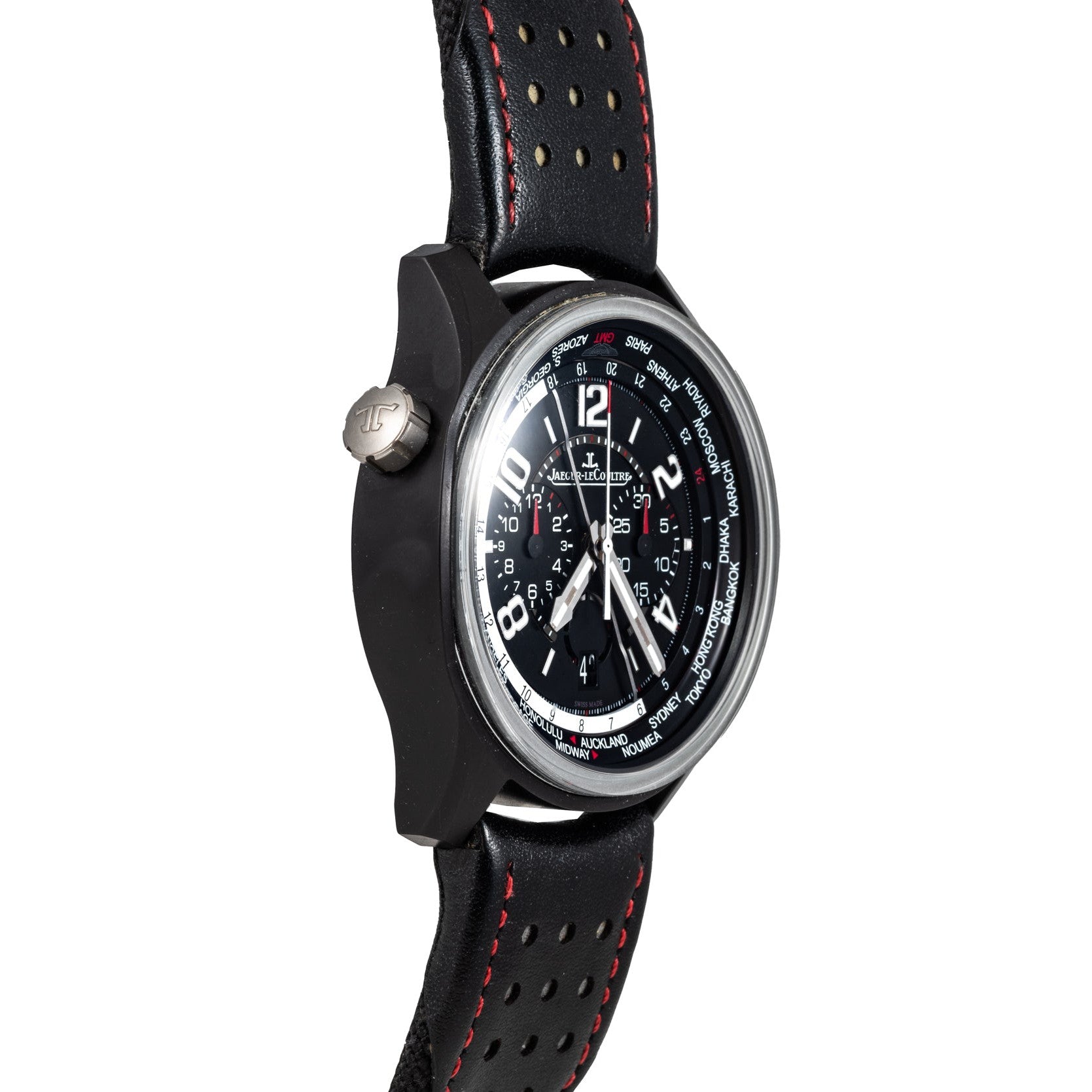 The Jaeger-LeCoultre Amvox 5 World Chronograph wristwatch, by Jaeger-LeCoultre, features a detailed dial, black perforated band with red stitching, and is displayed at an angle.