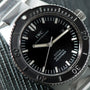 Close-up of an IWC Schaffhausen Aquatimer GST 2000 dive watch featuring a black dial, silver accents, and a stainless steel band.