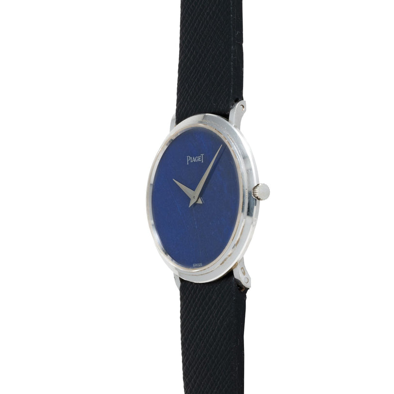 A Piaget Ladies Lapis Lazuli Dress Watch with a striking blue face and a black strap, displayed at an angle.