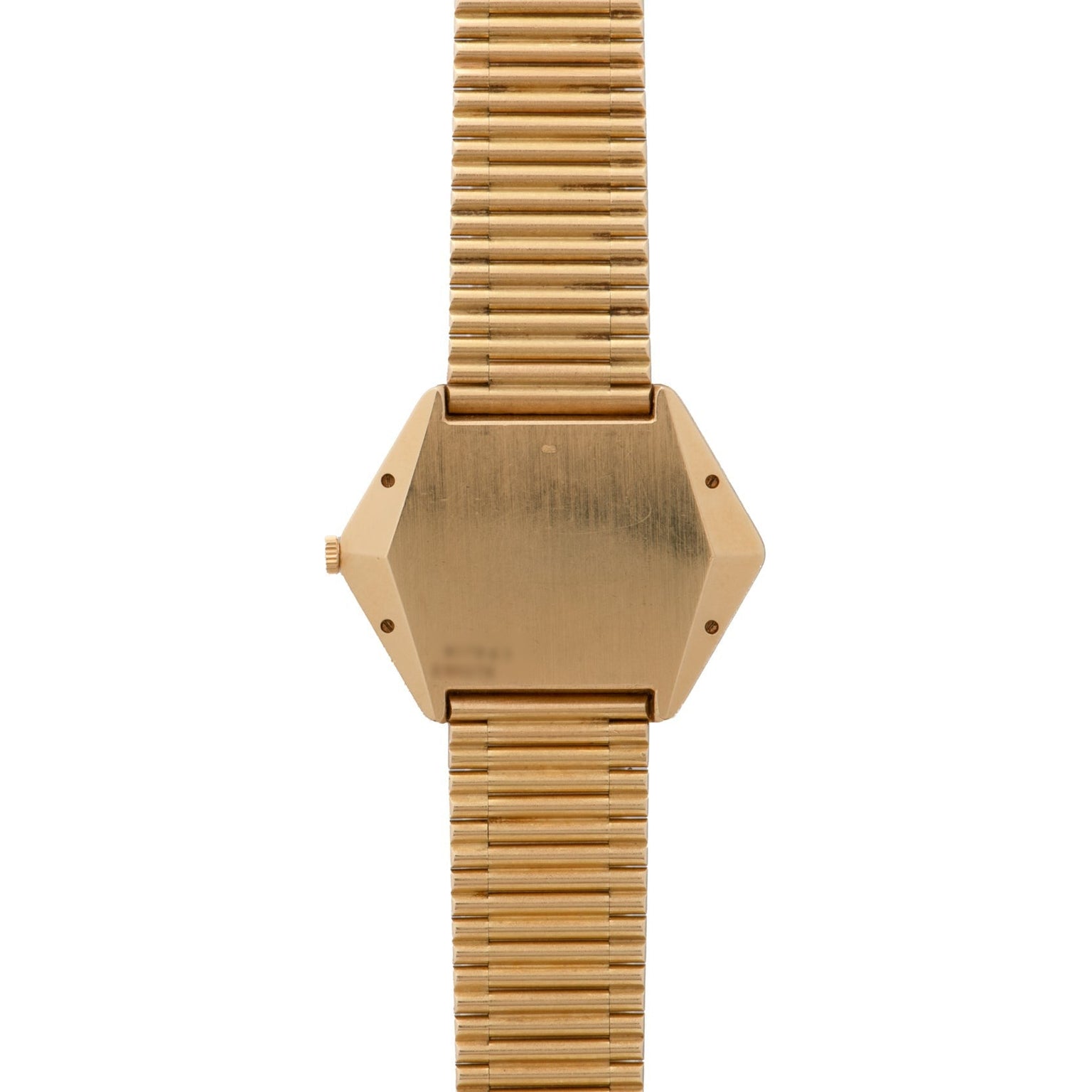 Piagets Hexagonal Tigers Eye gold wristwatch features a geometric hexagonal face and a ribbed metal band, shown from the back.