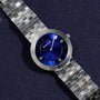 An Audemars Piguet Classic White Gold Ultra-Thin wristwatch rests on a dark textured surface.